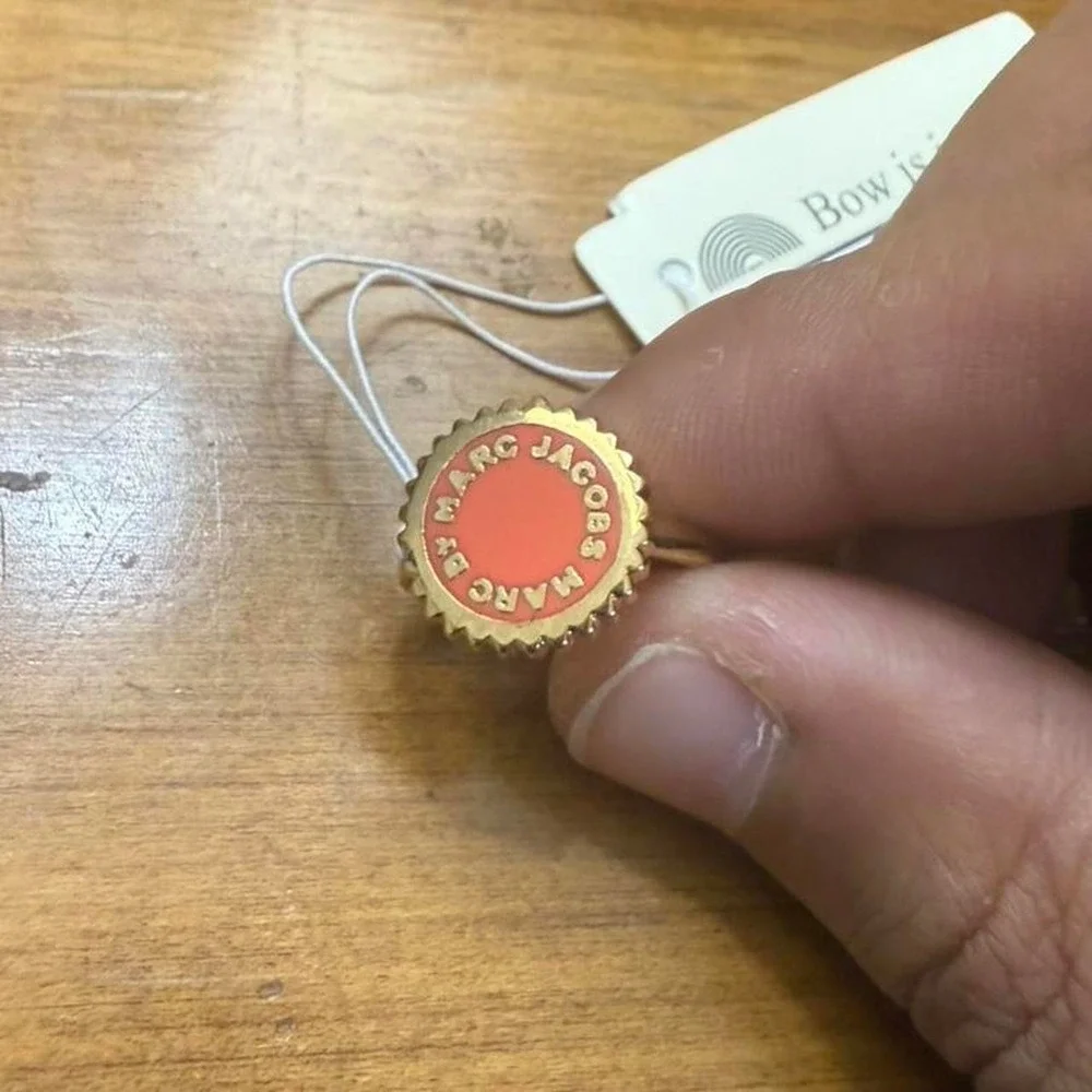 Marc‎ Jacobs gold tone ring with red accents